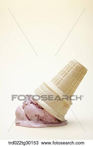 Stock Image - Crushed strawberry ice cream cone. Fotosearch