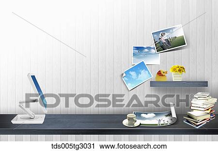 Stock Image - Desk With Monitor And Photos. Fotosearch
