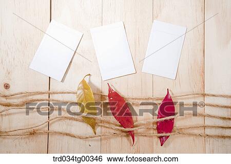 Fallen Leaves With Strings And White Papers On Wooden Surface View Large Photo Image Stock Photograph - Fallen Leaves With Strings And White Papers On Wooden Surface. Fotosearch