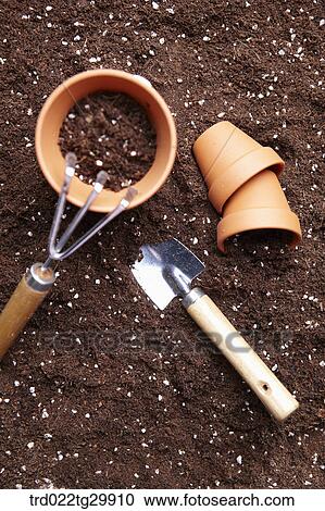 flowerpots and shovel and hook is on the dirt View Large Photo Image Stock Image - flowerpots and shovel and hook is on the dirt. Fotosearch
