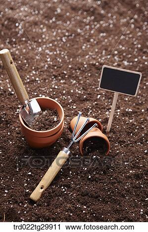 flowerpots and shovel and hook is on the dirt View Large Photo Image Stock Image - flowerpots and shovel and hook is on the dirt. Fotosearch