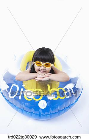 Stock Photo - girl is lying face down on the boat. Fotosearch