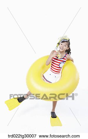Stock Photo - girl is wearing snorkels and tube and flippers. Fotosearch