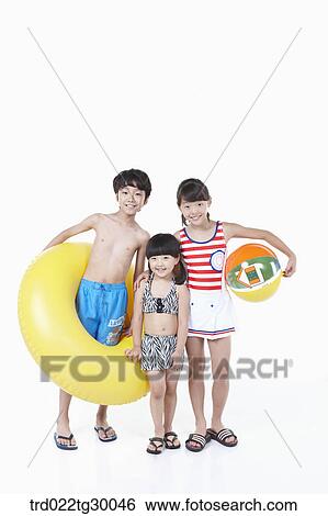 girls and boy are in swimsuit with tube and beach ball View Large Photo Image Stock Photograph - girls and boy are in swimsuit with tube and beach ball. Fotosearch