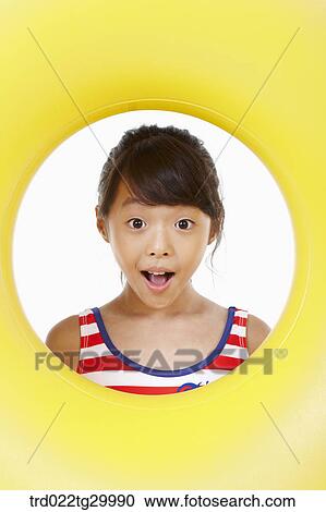girl's face was seen through the hole of tube View Large Photo Image Stock Image - girl's face was seen through the hole of tube. Fotosearch