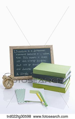 Stock Photo - Greenish Books With Black Board And An Alarm Clock. Fotosearch