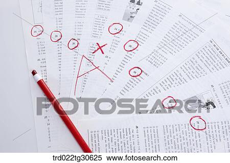 Stock Photography - Marked Test Papers With A Red Color Pencil. Fotosearch