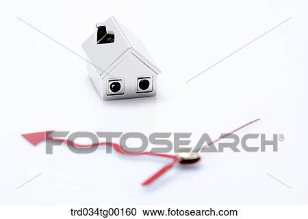 Stock Image - miniature house with hands of clock. Fotosearch