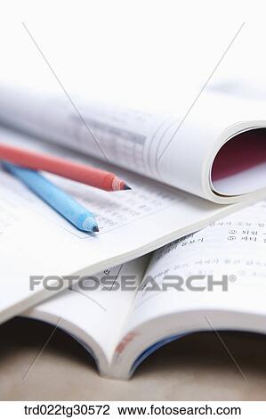 Stock Image - Open Books And Pencils. Fotosearch