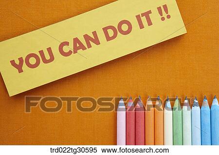 Stock Photography - Orange Book With Various Colors Of Pencils. Fotosearch