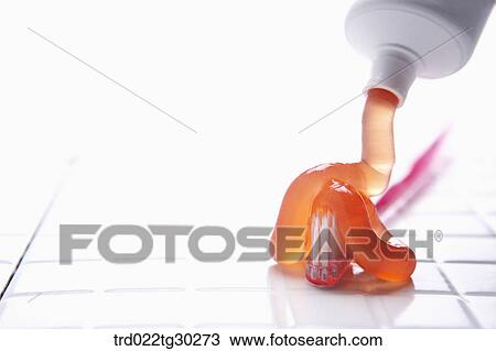 Orange tooth paste squeezed onto pink tooth brush View Large Photo Image Stock Image - Orange tooth paste squeezed onto pink tooth brush . Fotosearch