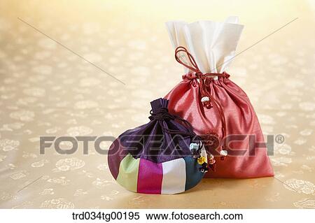 Patched colorful lucky bag and red lucky bag View Large Photo Image Stock Photography - Patched colorful lucky bag and red lucky bag . Fotosearch