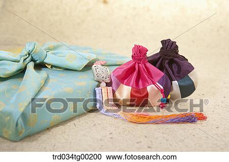 Patched lucky bags and blue wrapped package in cloth View Large Photo Image Stock Image - Patched lucky bags and blue wrapped package in cloth . Fotosearch