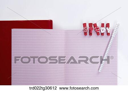Stock Image - Pink Note Book With Red Alphabet Pegs. Fotosearch