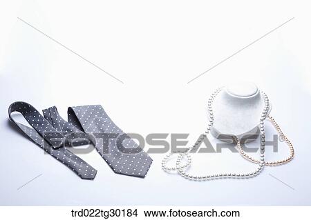 Polka dot tie and pearl necklace View Large Photo Image Picture - Polka dot tie and pearl necklace. Fotosearch