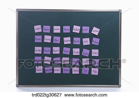 Stock Photo - Purplish Post Its Of Various Words On A Blackboard. Fotosearch