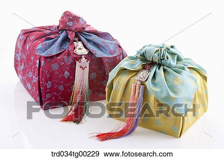 Red and green traditional wrapped package in cloth View Large Photo Image Stock Photo - Red and green traditional wrapped package in cloth . Fotosearch