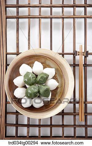 Picture - Rice cake and chopsticks on Korean traditonal door. Fotosearch