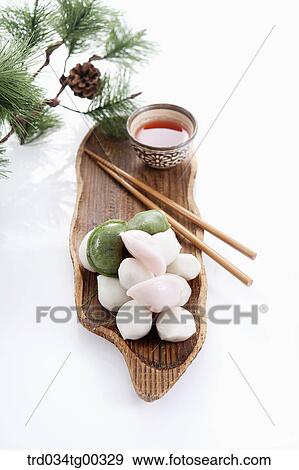 Rice cake, chopsticks, and a cup of tea with pine branch View Large Photo Image Stock Photo - Rice cake, chopsticks, and a cup of tea with pine branch . Fotosearch