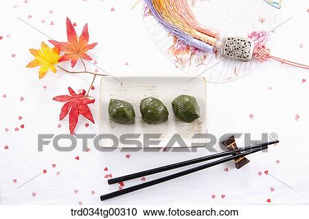 Rice cake, chopsticks, traditional clothes accessory, and a fan View Large Photo Image Stock Image - Rice cake, chopsticks, traditional clothes accessory, and a fan. Fotosearch