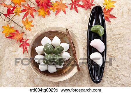 Rice cake with colored leaves around View Large Photo Image Stock Photography - Rice cake with colored leaves around. Fotosearch