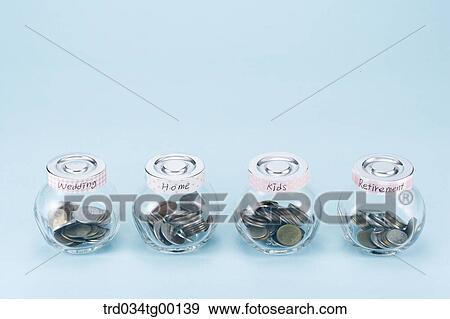 saving coins for living items View Large Photo Image Stock Photo - saving coins for living items. Fotosearch