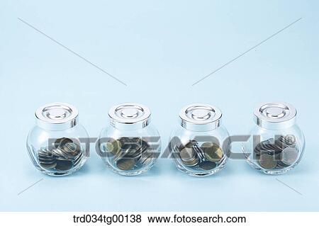 saving coins in glass bottle View Large Photo Image Stock Photo - saving coins in glass bottle. Fotosearch