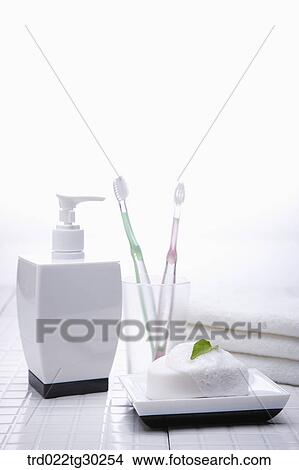 Shampoo, tooth brushes, soap and folded towels View Large Photo Image Picture - Shampoo, tooth brushes, soap and folded towels . Fotosearch
