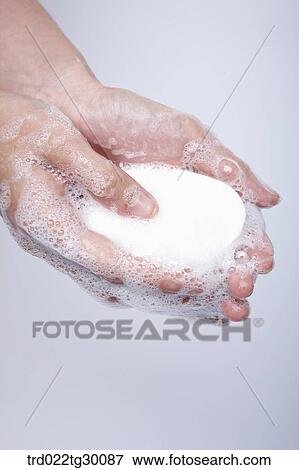 Stock Photo - soap in hands. Fotosearch