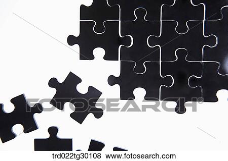 Some black pieces of puzzle out of other puzzles put together View Large Photo Image Stock Photo - Some black pieces of puzzle out of other puzzles put together. Fotosearch