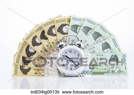 spreaded money bills and clock View Large Photo Image Stock Photography - spreaded money bills and clock. Fotosearch
