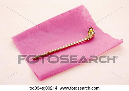 Traditional gold hair accessory on the pink Korean paper View Large Photo Image Picture - Traditional gold hair accessory on the pink Korean paper . Fotosearch