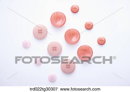 Stock Photo - Two Different Colors And Sizes Of Round Buttons. Fotosearch
