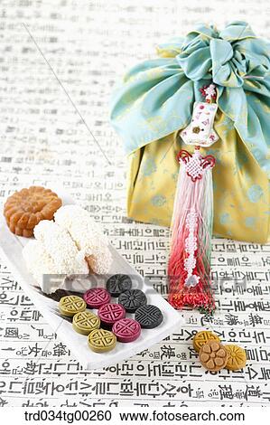 Various Korean dessert and traditional wrapped package with clothes accessory View Large Photo Image Stock Image - Various Korean dessert and traditional wrapped package with clothes accessory. Fotosearch