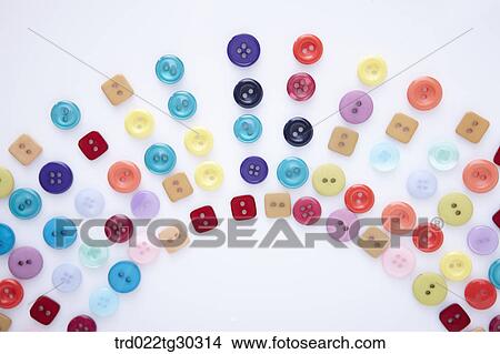 Picture - Various Sizes And Shapes Of Colorful Buttons In Fan Shape. Fotosearch