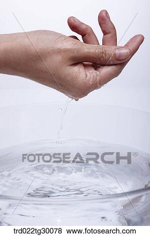 Stock Photo - washing hand in basin. Fotosearch