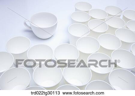 Stock Image - White paper cup and white mug. Fotosearch