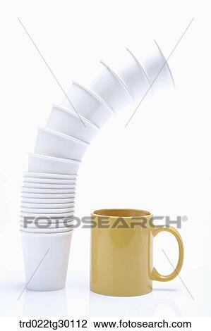 Stock Image - Winding pack of paper cup and yellow mug. Fotosearch