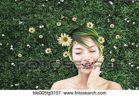 Woman'S Head Covered With Long Leaves And Flowers On Lawn View Large Photo Image Stock Photo - Woman'S Head Covered With Long Leaves And Flowers On Lawn. Fotosearch