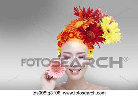 Stock Photo - Woman'S Head Covered With Many Flowers. Fotosearch