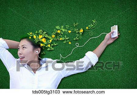 Woman'S Head Covered With Yellow Flowers And Green Leaves With Ipod View Large Photo Image Stock Image - Woman'S Head Covered With Yellow Flowers And Green Leaves With Ipod. Fotosearch