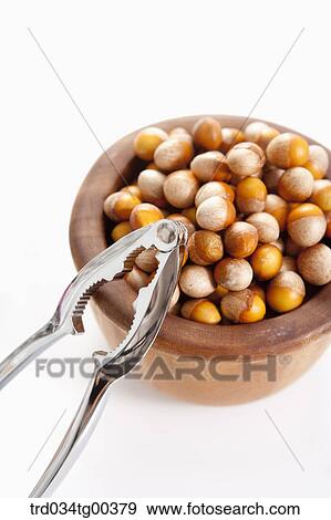 Wooden Bowl Of Ginkos And A Nutcracker On Top View Large Photo Image Stock Photo - Wooden Bowl Of Ginkos And A Nutcracker On Top. Fotosearch