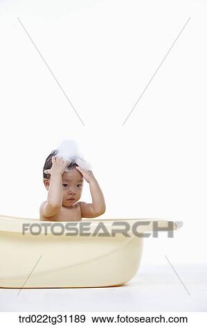 A baby making bubble on his head View Large Photo Image Stock Photo - A baby making bubble on his head. Fotosearch