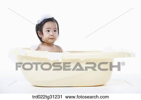 A baby taking a bath in the bathtub with the bubble on her body View Large Photo Image Stock Image - A baby taking a bath in the bathtub with the bubble on her body. Fotosearch