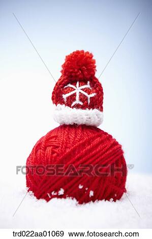 A ball of red wool and red knit hat on the snow View Large Photo Image Stock Photo - A ball of red wool and red knit hat on the snow. Fotosearch