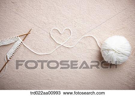 A ball of white wool and knitting needles making the heart View Large Photo Image Stock Image - A ball of white wool and knitting needles making the heart. Fotosearch