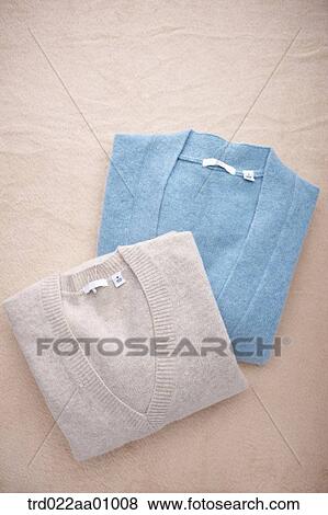 Stock Photo - A folded ivory and blue knit. Fotosearch