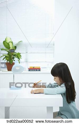 A girl reading a book with a pencil in her hand View Large Photo Image Stock Image - A girl reading a book with a pencil in her hand. Fotosearch