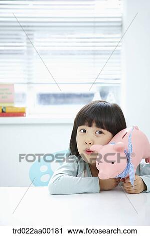 A girl with a pink piggy bank on her face View Large Photo Image Stock Image - A girl with a pink piggy bank on her face. Fotosearch