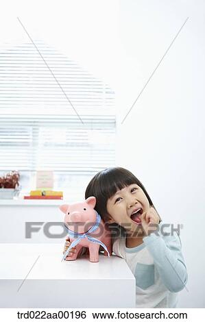 A girl with a pink piggy bank on her face View Large Photo Image Stock Photograph - A girl with a pink piggy bank on her face. Fotosearch